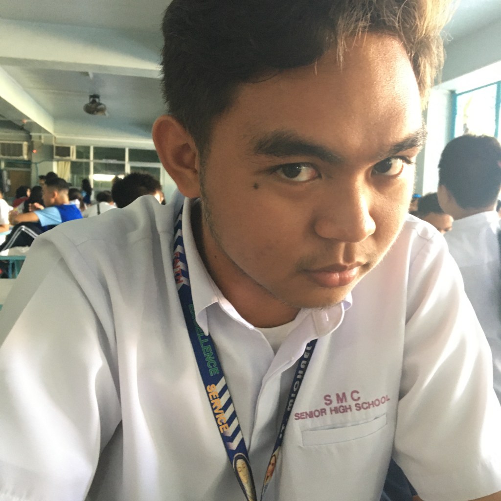 A picture containing indoor, person

Description automatically generated